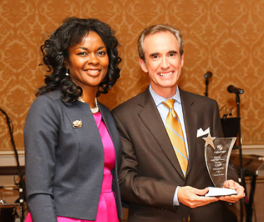 Honoree Colin Gillespie, President of Lego Education, receives his award