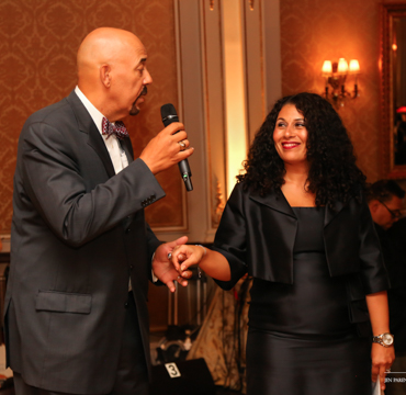 Inas Morsi-Hogans, Assistant Principal, Trinity Elementary, receiving the Village Ambassador Award